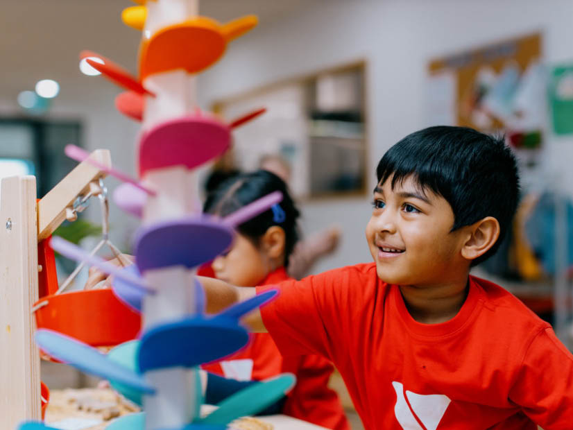 Boy playing with game at Tarneit Early Learning Centre