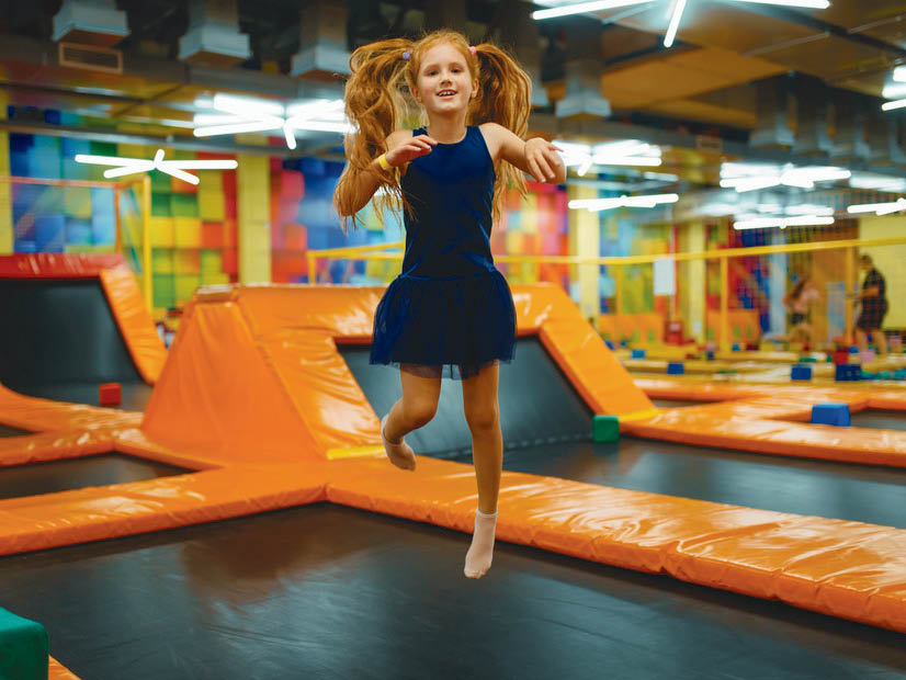 Girl jumping on trampoline at a Bounce activity centre