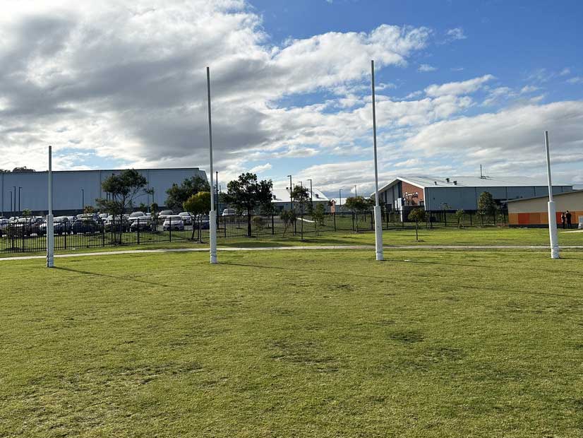 Armstrong Creek school sports oval with AFL goal posts 