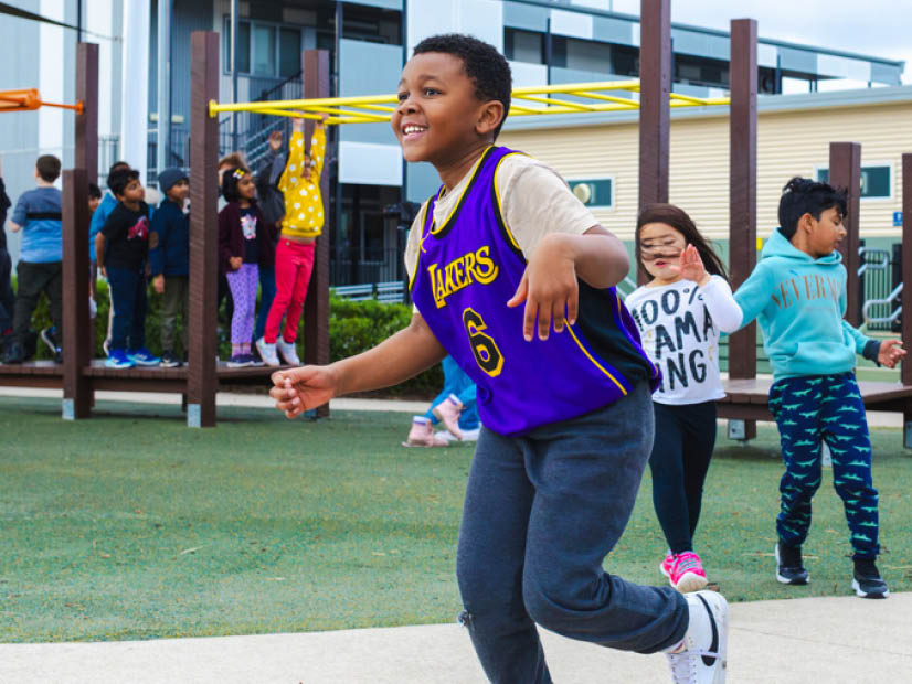 Kids running in the playground at after school care